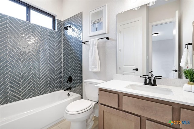 full bathroom with tile patterned floors, vanity, toilet, and tiled shower / bath combo