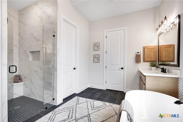 bathroom with tile patterned flooring, plus walk in shower, and vanity