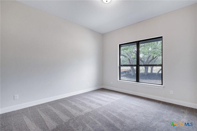 empty room with carpet flooring