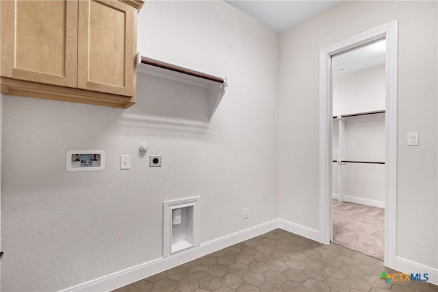 clothes washing area with electric dryer hookup, washer hookup, hookup for a gas dryer, and cabinets