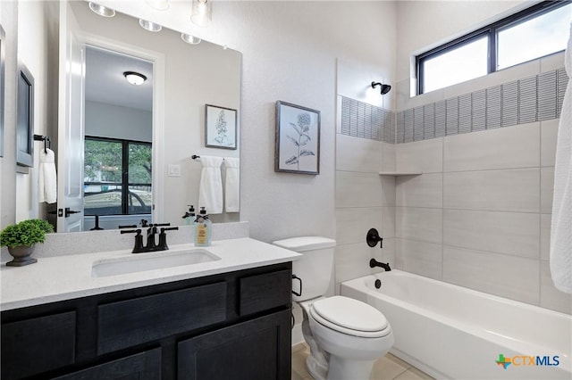 full bathroom featuring vanity,  shower combination, and toilet