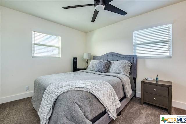 bedroom with dark colored carpet and ceiling fan