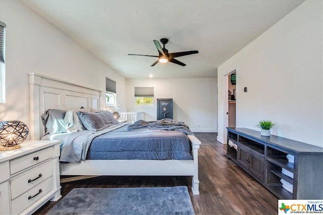 bedroom with ceiling fan and dark wood-type flooring