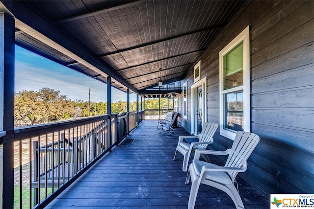 wooden terrace with a porch