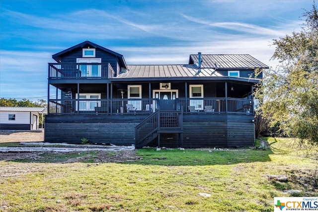 view of front of home with a porch and a front yard