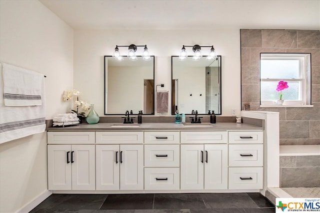 bathroom featuring tile patterned flooring and vanity