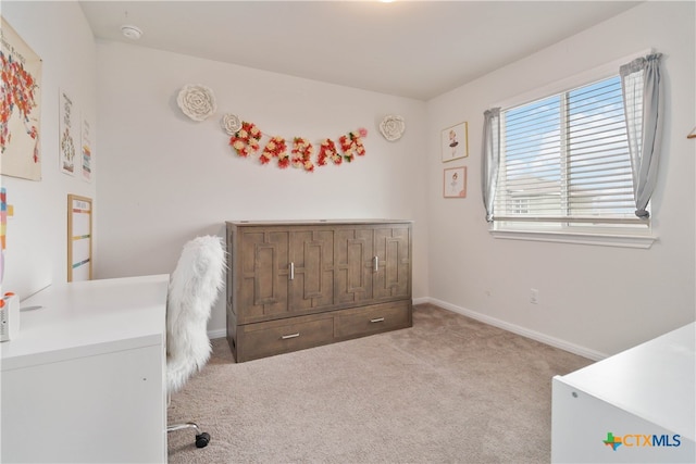 bedroom with light carpet