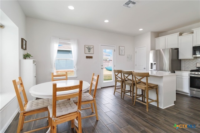 dining room with dark hardwood / wood-style floors