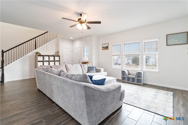 living room with dark wood-type flooring and ceiling fan