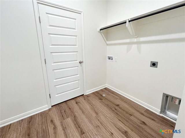 laundry area with hardwood / wood-style floors, hookup for a washing machine, and hookup for an electric dryer