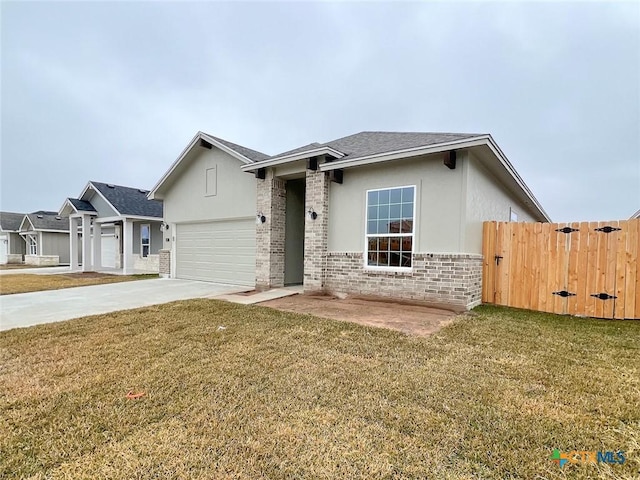 single story home with a garage and a front yard