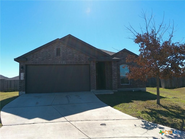 single story home with a garage and a front lawn