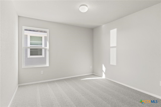 empty room featuring carpet flooring