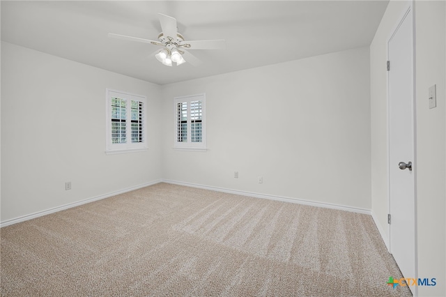 unfurnished bedroom with baseboards, a ceiling fan, and carpet floors