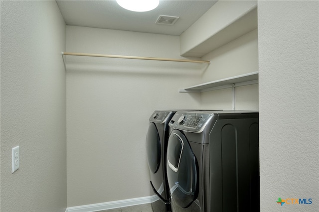 616 W Joppa Rd, Leander, TX 78641 - washroom featuring washer and dryer and baseboards