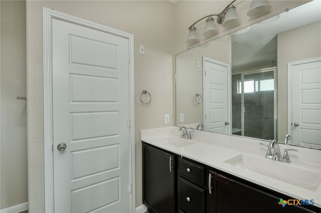 616 W Joppa Rd, Leander, TX 78641 - bathroom featuring double vanity and a stall shower
