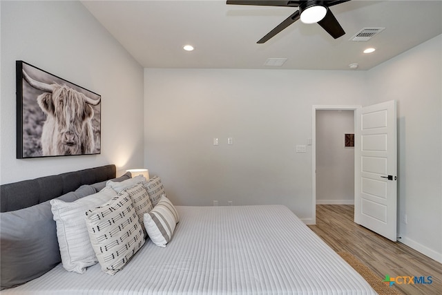 bedroom featuring hardwood / wood-style floors and ceiling fan