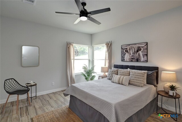 bedroom featuring ceiling fan and light wood-type flooring