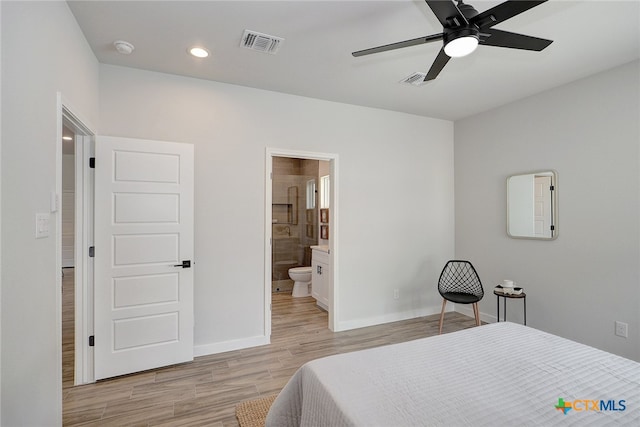 bedroom featuring ceiling fan, connected bathroom, and light hardwood / wood-style flooring