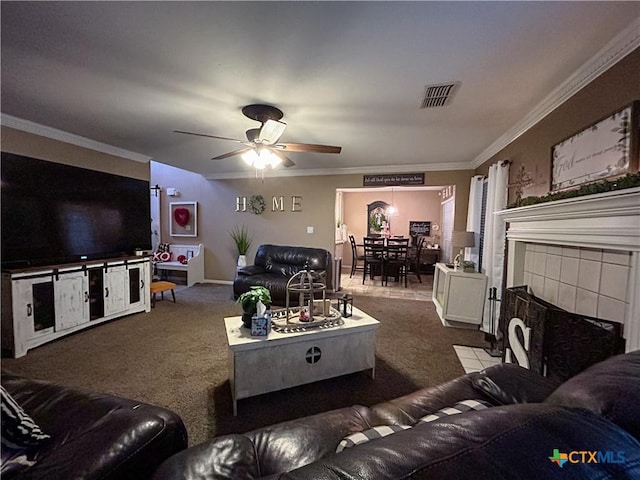 carpeted living room with crown molding and ceiling fan