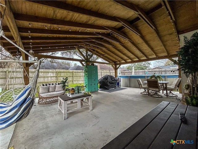 view of patio / terrace featuring a fenced in pool and outdoor lounge area