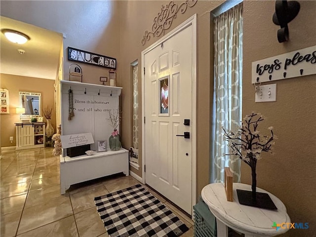 mudroom featuring light tile patterned floors