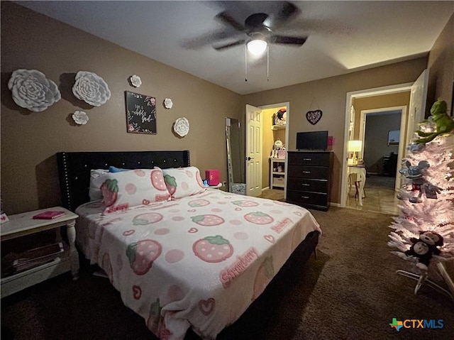 bedroom featuring ceiling fan and dark colored carpet