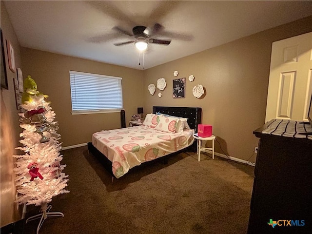 bedroom with dark colored carpet and ceiling fan