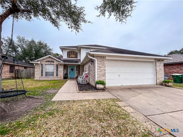 view of front of house featuring a garage and a front yard