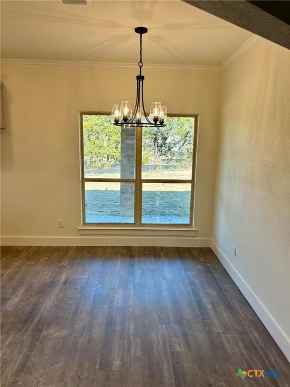 unfurnished dining area with an inviting chandelier, crown molding, and dark hardwood / wood-style floors