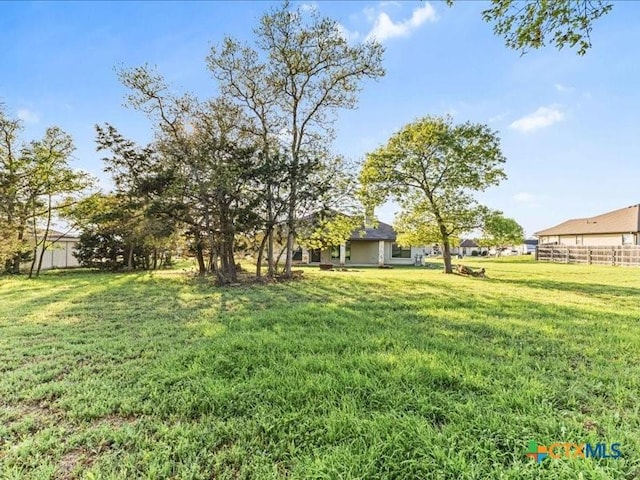 view of yard featuring fence
