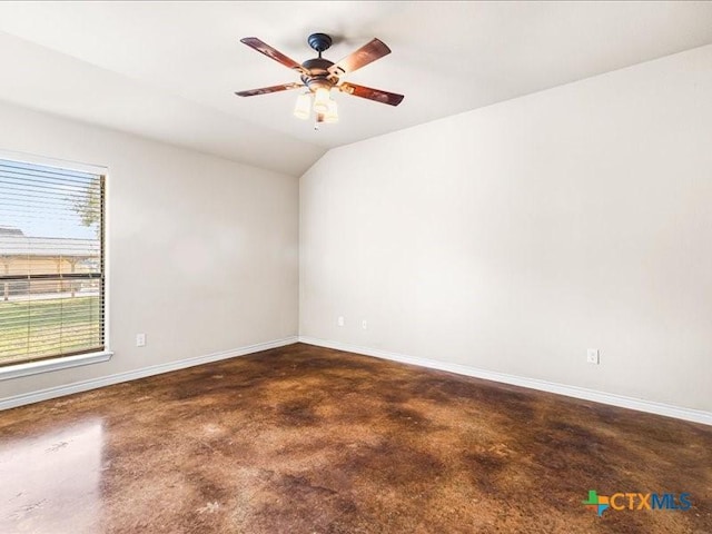 unfurnished room with baseboards, finished concrete flooring, ceiling fan, and lofted ceiling