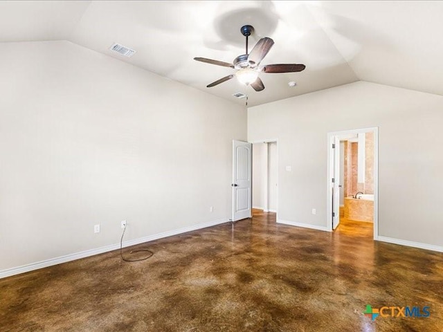 unfurnished bedroom with lofted ceiling, finished concrete floors, ensuite bath, baseboards, and visible vents