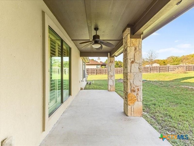 view of patio / terrace featuring fence and ceiling fan