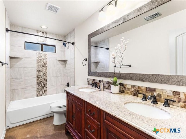 full bathroom with toilet, a sink, and visible vents
