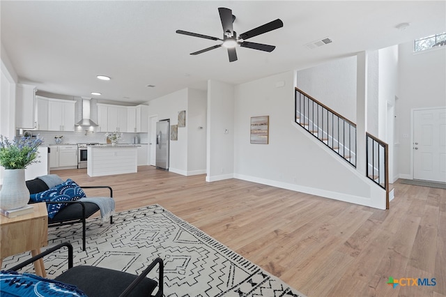 2534 Duval Dr, New Braunfels, TX 78130 - living area with ceiling fan, light wood-type flooring, stairs, and recessed lighting