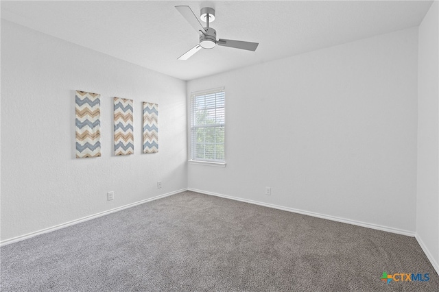 2534 Duval Dr, New Braunfels, TX 78130 - spare room featuring dark colored carpet and ceiling fan