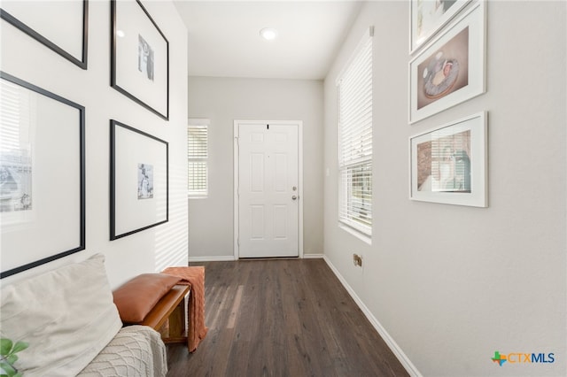 hallway with dark hardwood / wood-style floors