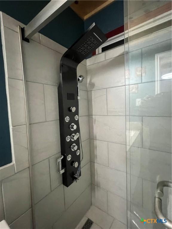 bathroom with an enclosed shower