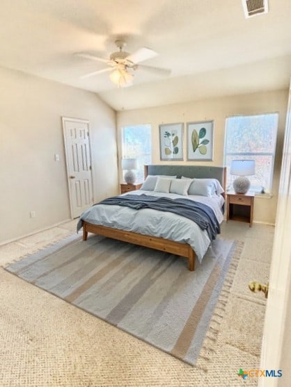 bedroom with light carpet and ceiling fan