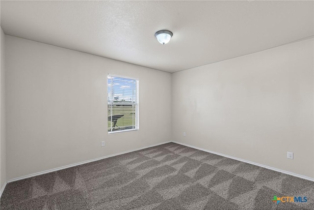 2205 Bald Eagle Ct, Killeen, TX 76549 - spare room with dark colored carpet and baseboards