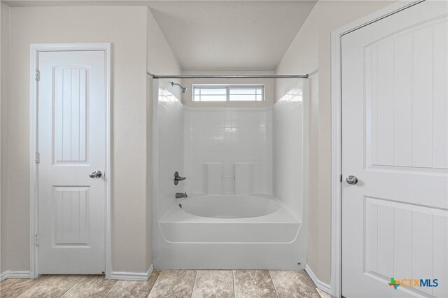 2205 Bald Eagle Ct, Killeen, TX 76549 - full bathroom with baseboards and washtub / shower combination