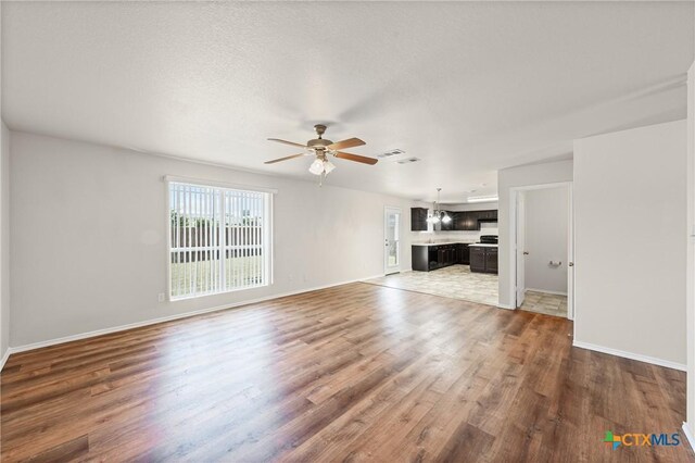 2205 Bald Eagle Ct, Killeen, TX 76549 - unfurnished living room featuring ceiling fan and wood finished floors