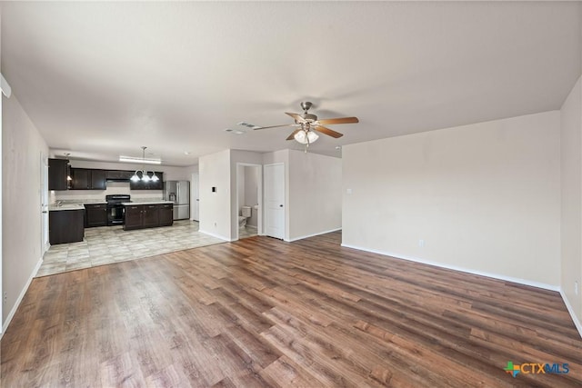 2205 Bald Eagle Ct, Killeen, TX 76549 - unfurnished living room featuring light wood-style flooring and a ceiling fan