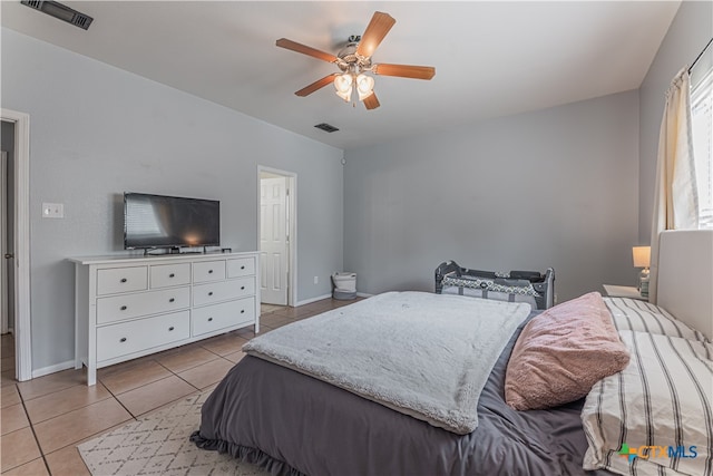 bedroom with light tile patterned flooring and ceiling fan