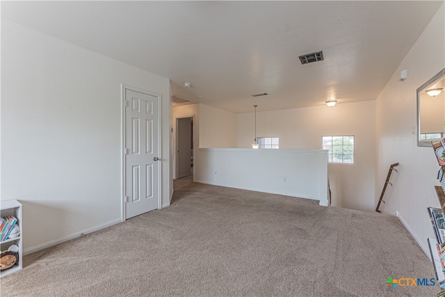 unfurnished room featuring carpet