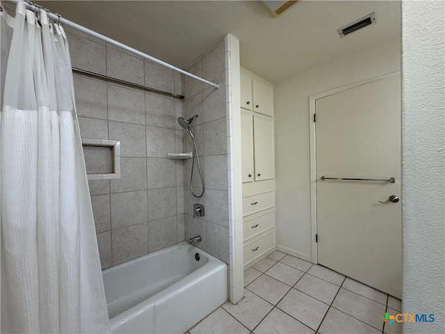1001 Brookhollow Dr, Port Lavaca, TX 77979 - full bathroom with shower / tub combo with curtain and tile patterned flooring