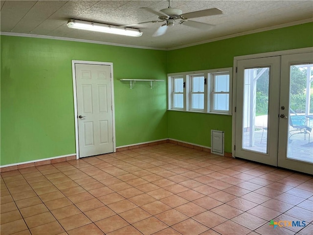 1001 Brookhollow Dr, Port Lavaca, TX 77979 - spare room featuring french doors, ceiling fan, crown molding, and light tile patterned floors