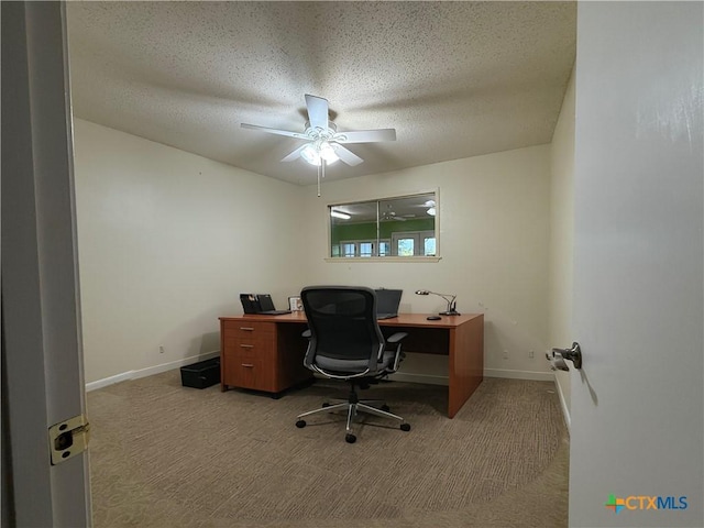 1001 Brookhollow Dr, Port Lavaca, TX 77979 - carpeted office space featuring ceiling fan and a textured ceiling