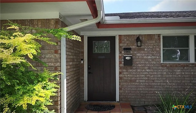 1001 Brookhollow Dr, Port Lavaca, TX 77979 - view of exterior entry with brick siding